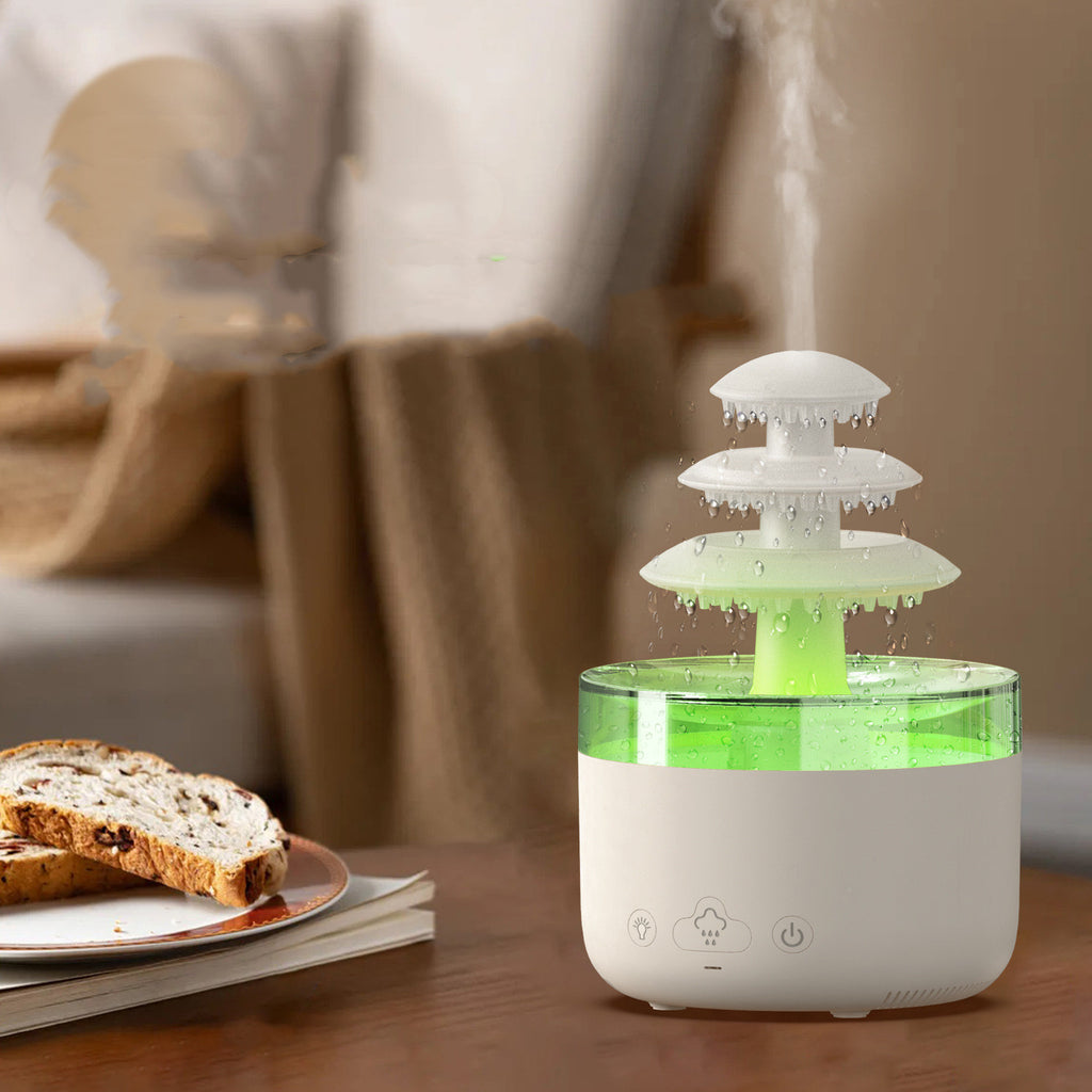 Humidificateur nuage de pluie en veilleuse verte sur une table de salon en bois