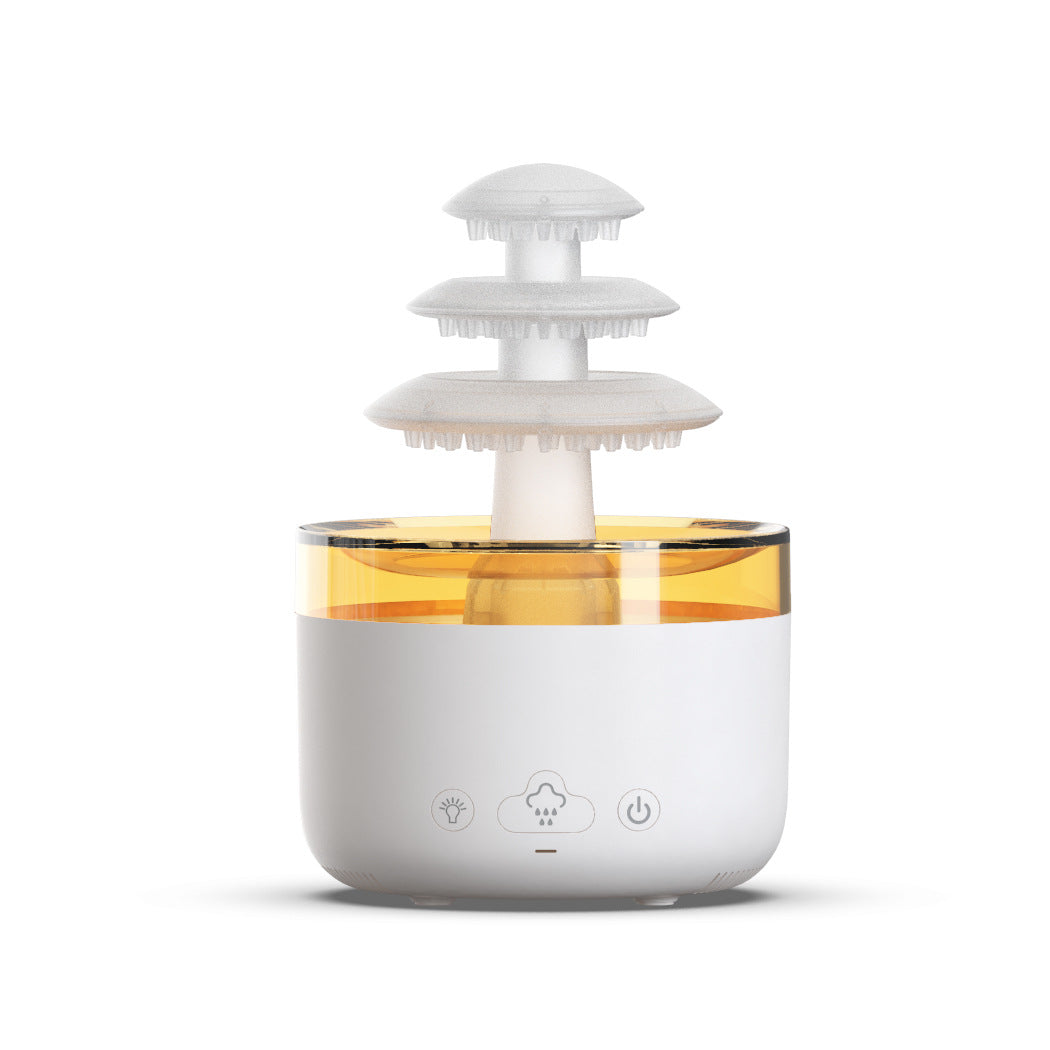 Humidificateur nuage de pluie coloris blanc sur fond blanc, bassin illuminé en ambré et trois plateaux superposés